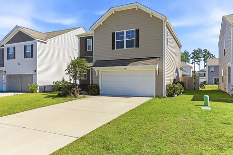 Front of 418 Eastern Pine Dr, a two-story home in Pine Hills at Cane Bay, Summerville SC