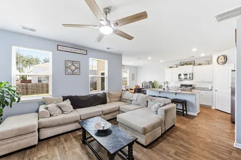Open living room flowing into the kitchen