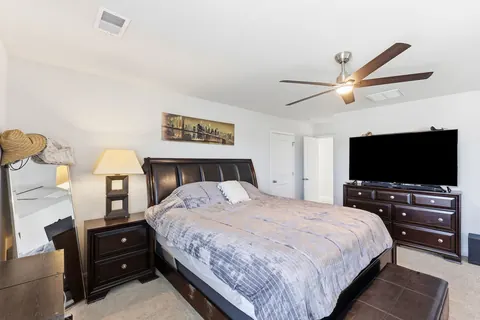 Spacious primary suite with room for a king bed