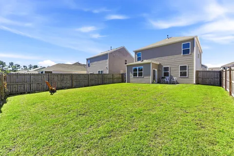 Level, fully fenced backyard