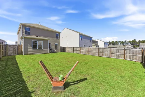 Backyard lawn inside the privacy fence
