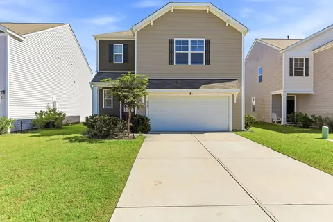 Front exterior with the 2-car garage and driveway